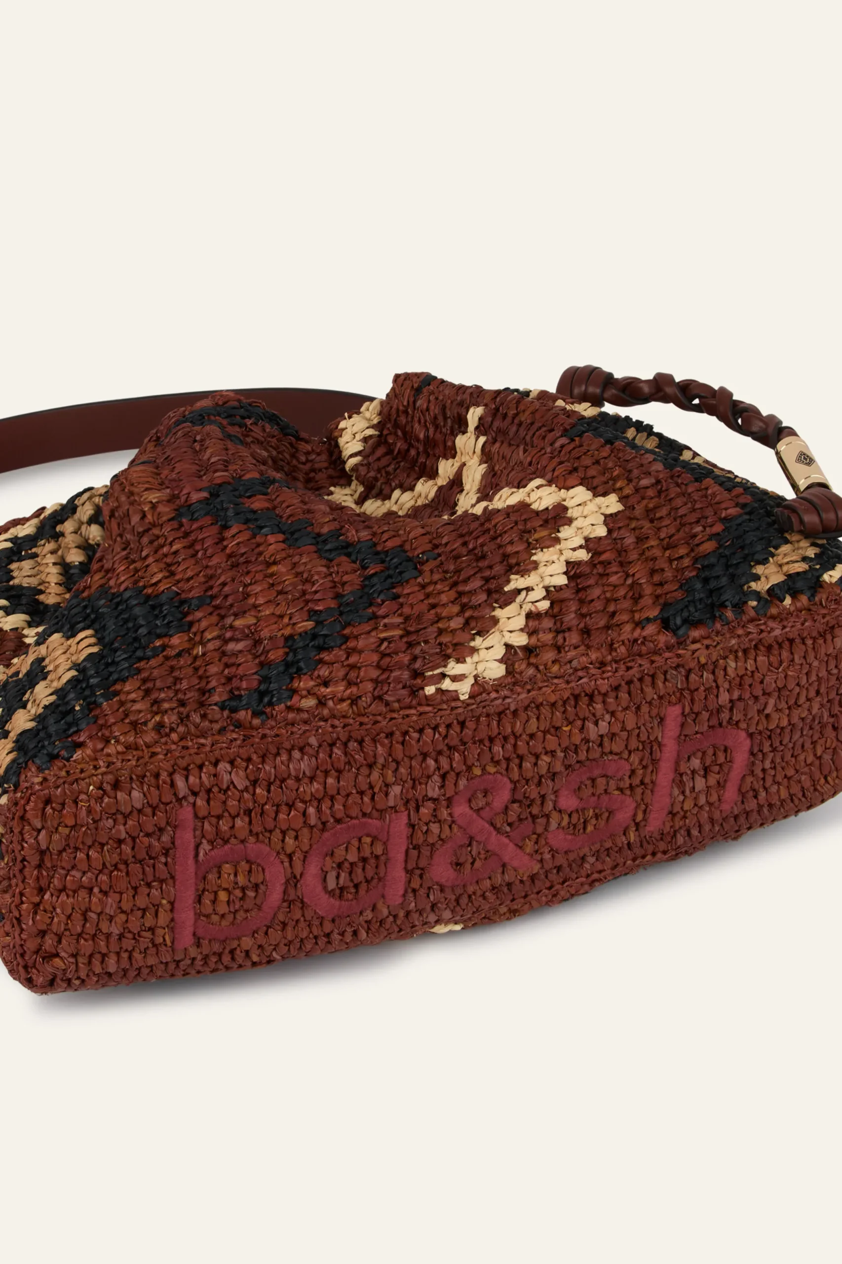 JUNE tribal-inspired raffia clutch