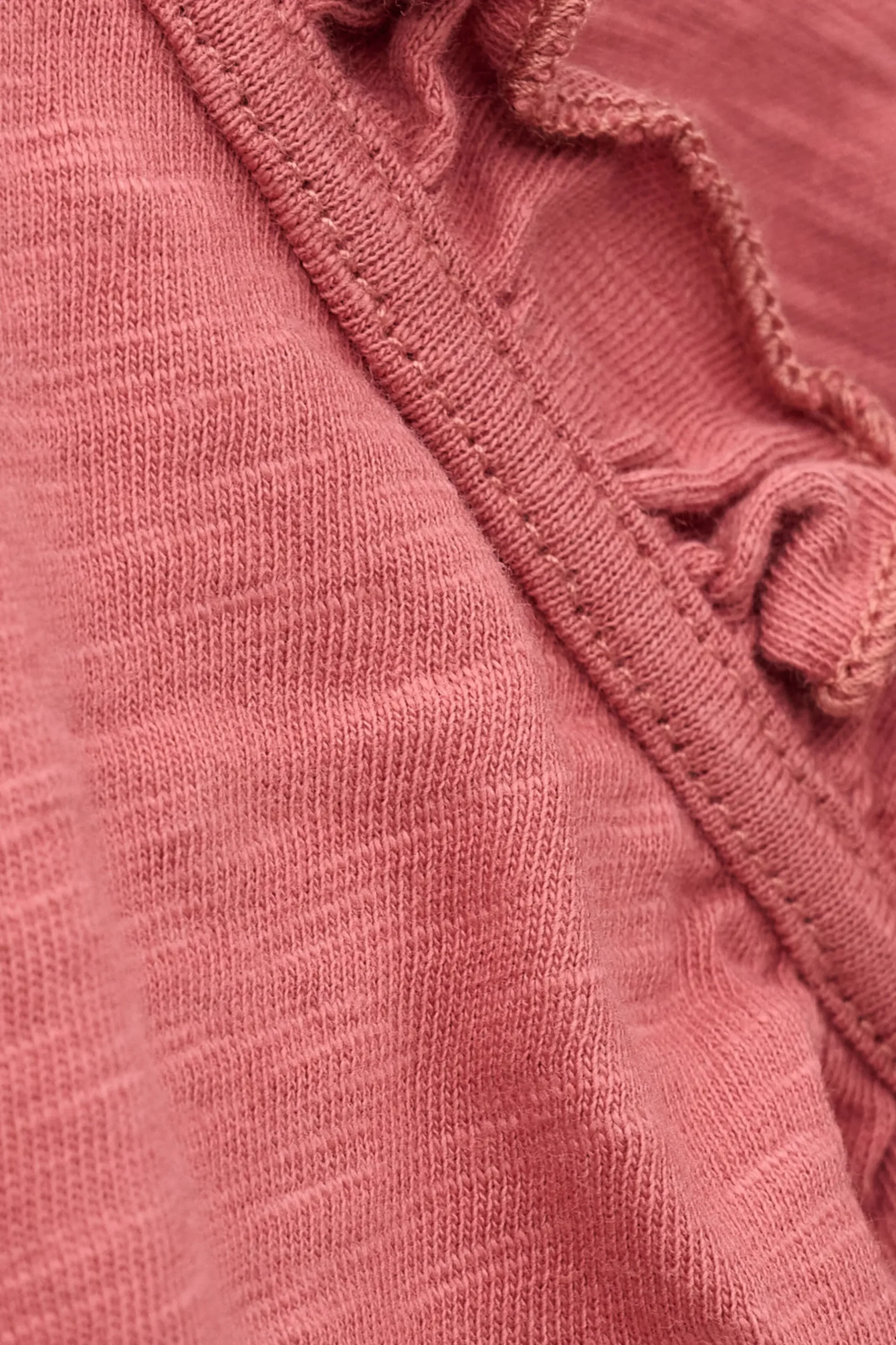 VERY top with ruffled sleeves